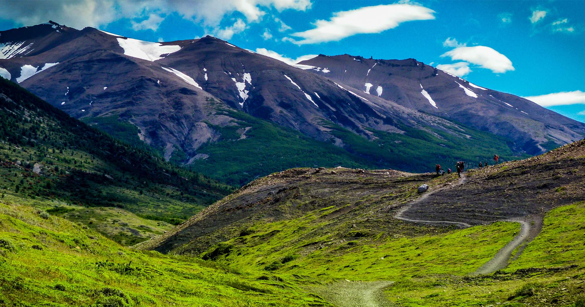 Glaciers on top of black mountains in Patagonia.