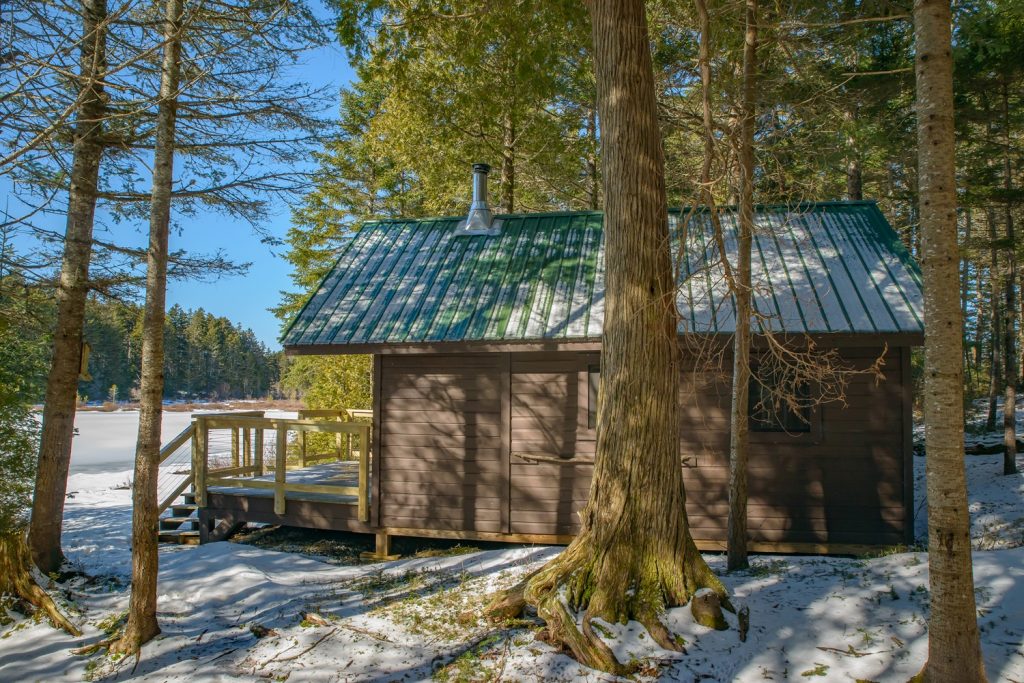 Side View of Honeymoon cabin in snow.
