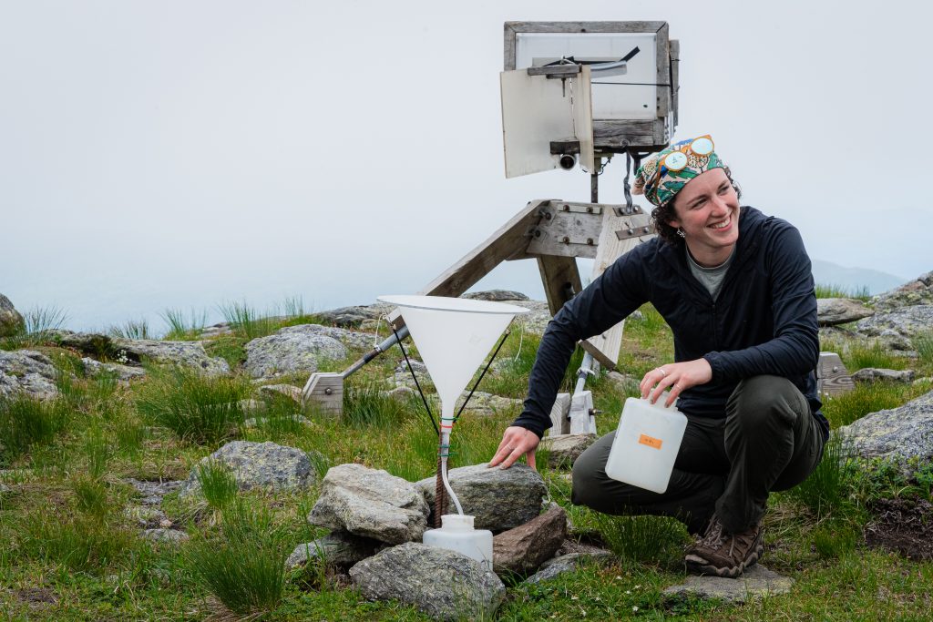  Alice Gipe kneels by cloud catching equipment.