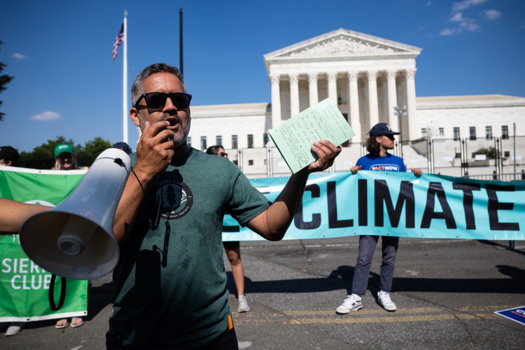 Ramon Cruz with a megaphone outside the U.S. Supreme Court building