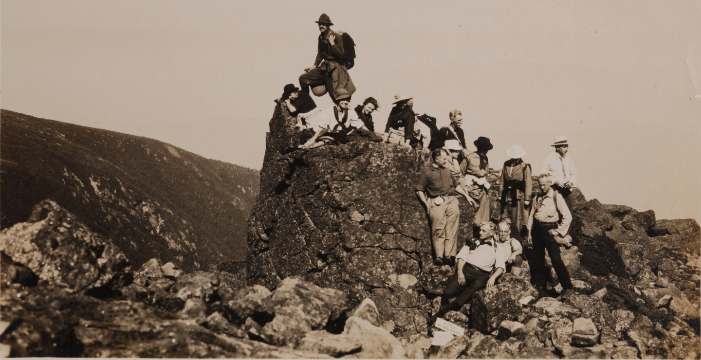 group of members on rock 1900s