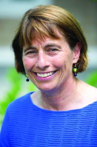 Eehrenfeld smiling in a blue shirt.