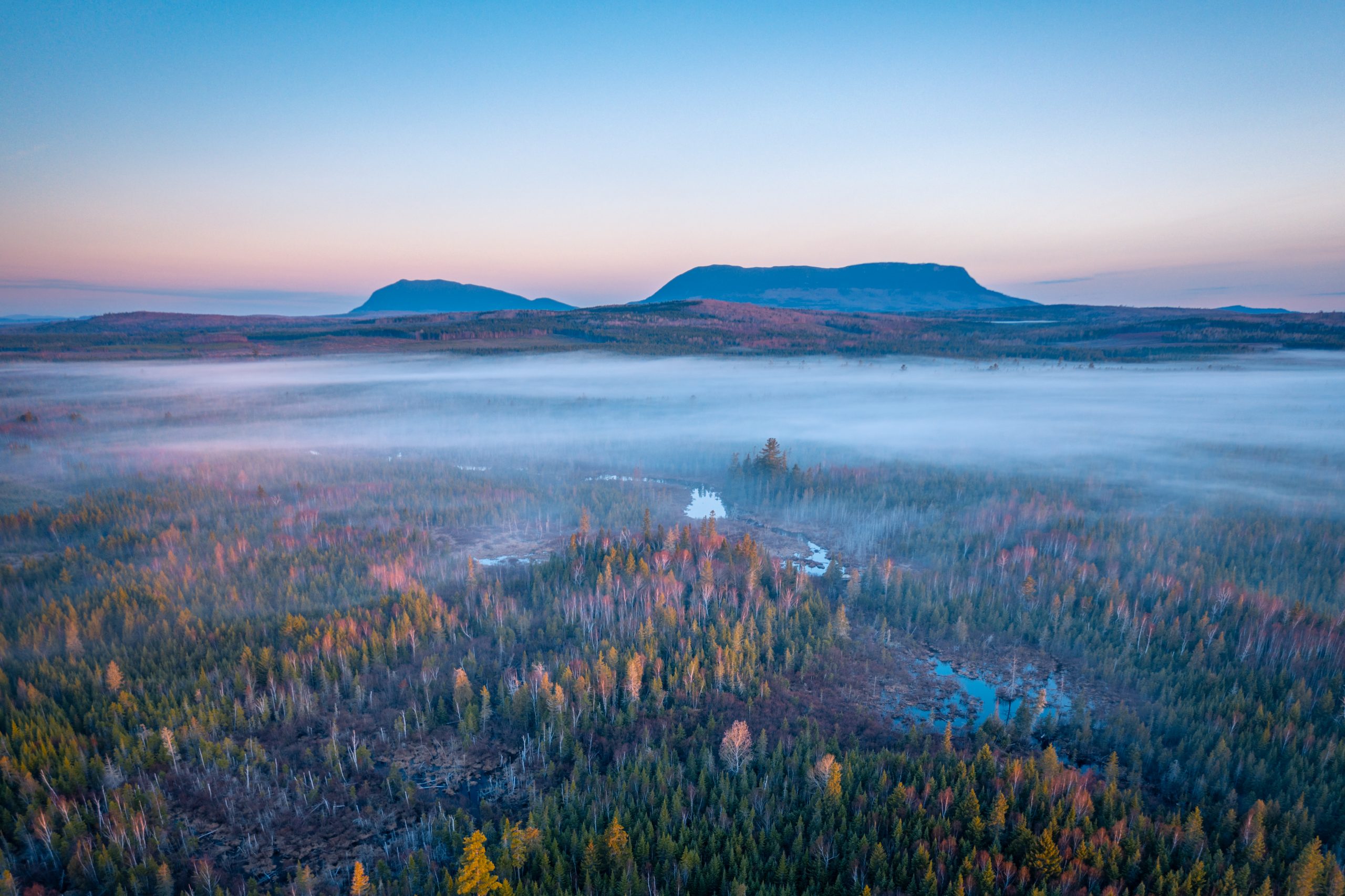Amc 100 Mile Wilderness aerial shot of forest and mountains.